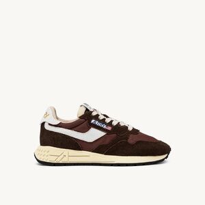 REELWIND SUEDE SNEAKERS IN EBONY AND WHITE.